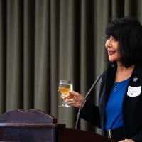President Mantella giving speech with glass in hand
